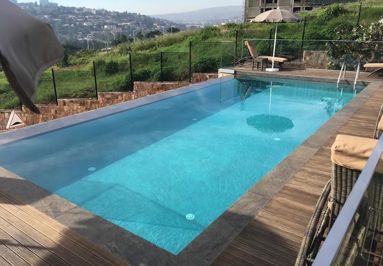The infinity pool and city view of the Onomo Hotel Kigali, designed by Cesare Ricchetti (RC Projet). The project was published in Architect Today magazine